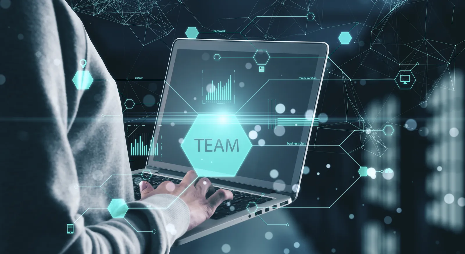 Business user on a laptop with a team icon and data charts showing shared IT support