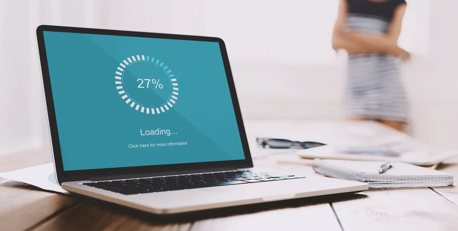 Laptop showing a data restore in progress at 27 percent