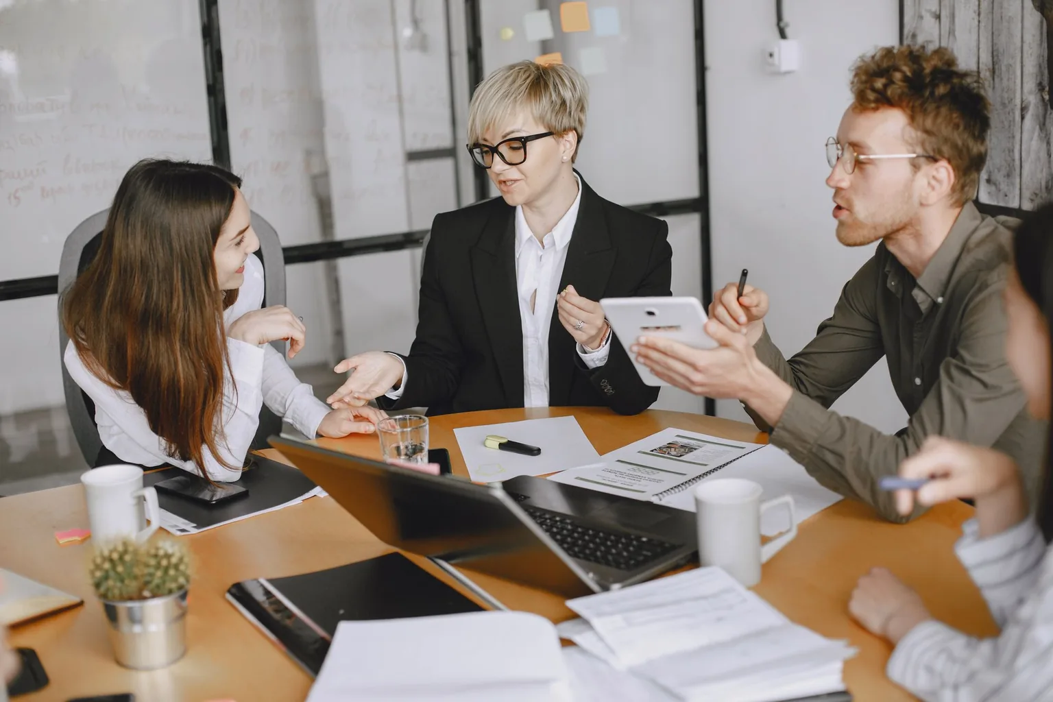 IT Consulting in Greensboro, NC IT consultant reviewing a technology plan with business clients in Greensboro, NC