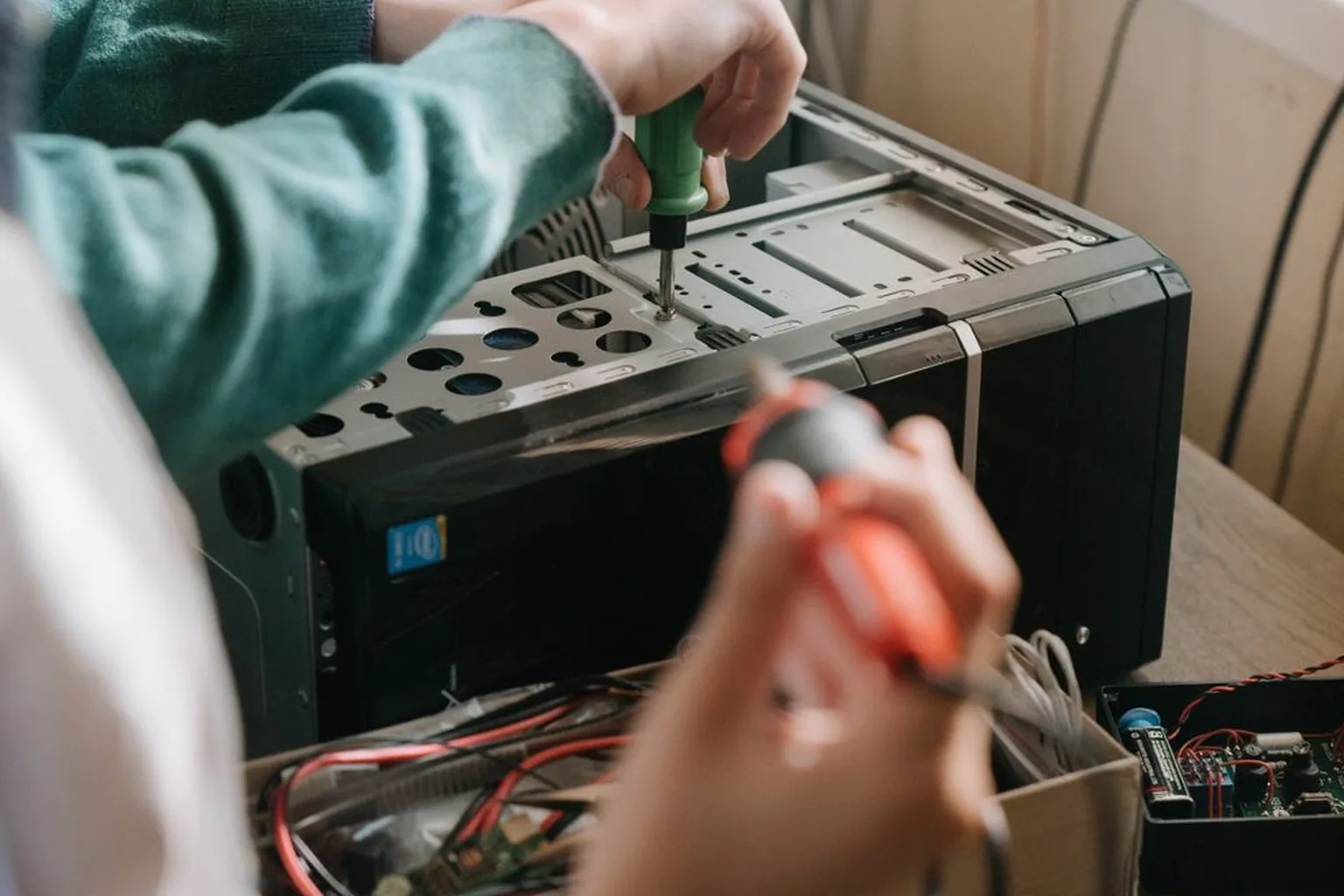 NerdsToGo technician repairing a desktop computer for a Greensboro, NC client