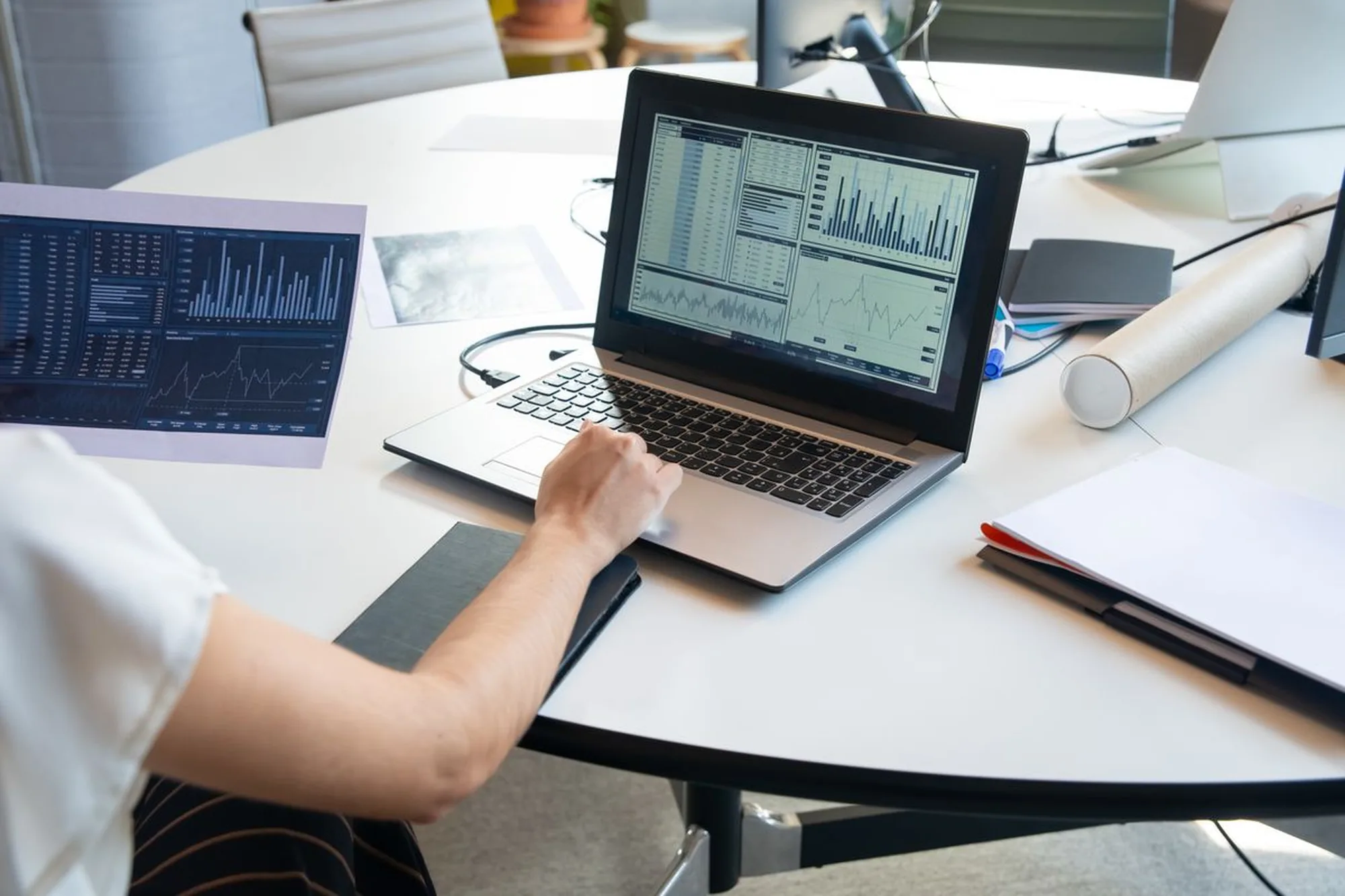 Laptop showing SEO performance analytics and traffic charts for a Greensboro, NC business