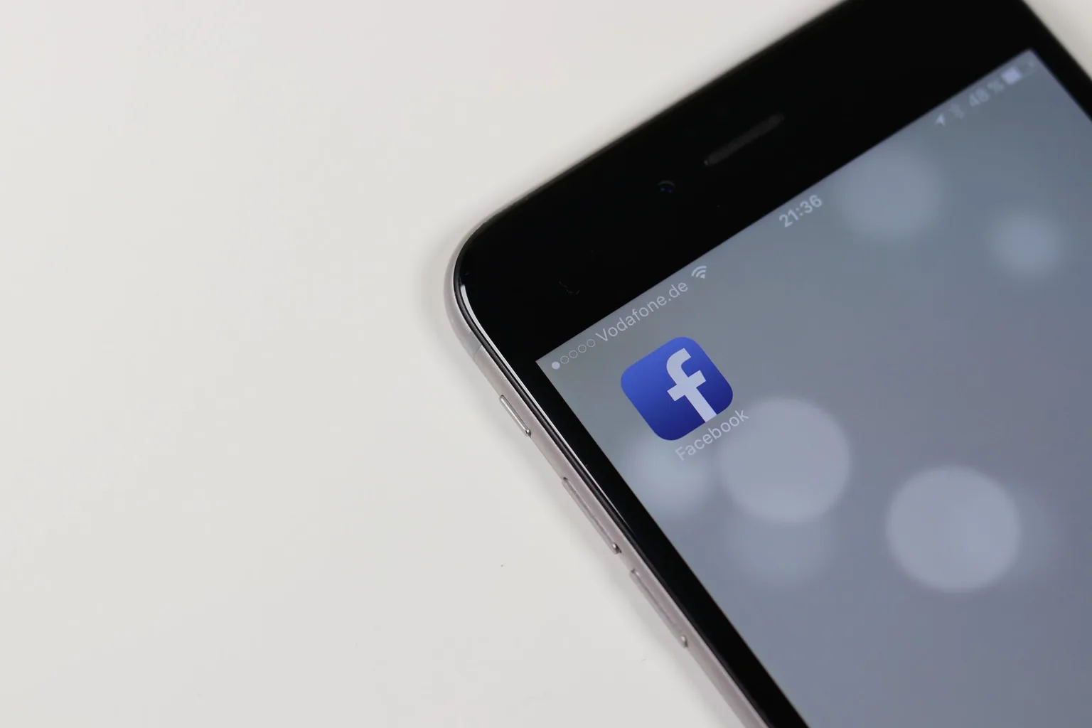 Phone showing the Facebook app, where we run social media ads for Greensboro, NC businesses