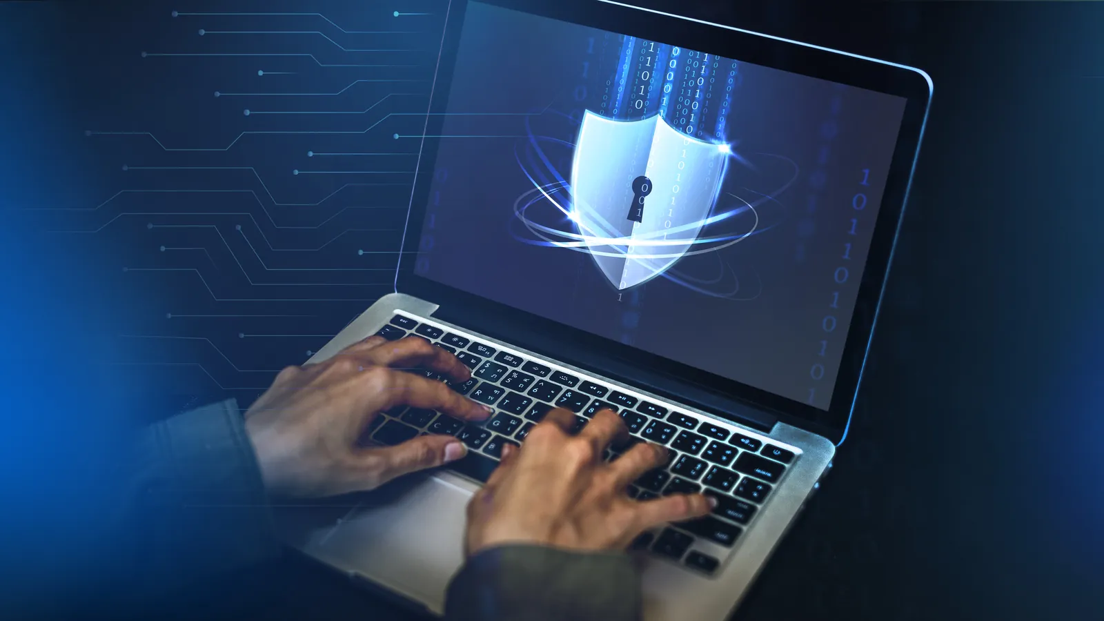 Laptop screen showing a security shield and lock after virus and malware removal